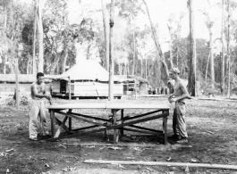 GIs of the 797th Engineer Forestry Company in Burma, playing ping pong in camp.  During WWII.