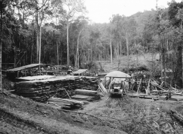 Site at the mill yard, of GIs sorting planks after ripping logs at a sawmill of the 797th Engineer Forestry Company in Burma.  During WWII.