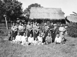 Local people in Burma near the 797th Engineer Forestry Company--women and children pose.  During WWII.