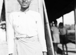 Local people in Burma near the 797th Engineer Forestry Company--a girl poses for the camera.  During WWII.