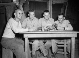 Engineers of the 797th Engineer Forestry Company pose in their barracks in Burma.  During WWII.