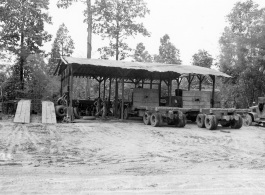 Engineers of the 797th Engineer Forestry Company at work at a truck repair garage at camp in Burma.  During WWII.