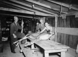 Engineers of the 797th Engineer Forestry Company pose with their catch after a round of huntin' deer in Burma.  During WWII.