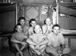 Engineers of the 797th Engineer Forestry Company pose in their barracks in Burma.  During WWII.