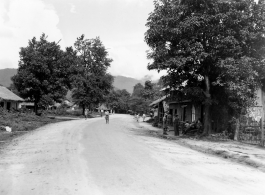 People on road in a village in Burma.  In Burma near the 797th Engineer Forestry Company.  During WWII.