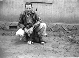 GI with dog on base in Yunnan, China, during WWII.
