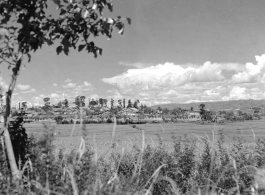 Rice paddies and walled town of Chanyi (Zhanyi), Yunnan, China, during WWII. 