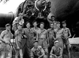 Engine change crew work on a C-47 transport plane in the CBI. 330th Troop Carrier, 9th CC. 1945.  Sergeant Arnold Wall in far back against the fuselage. 