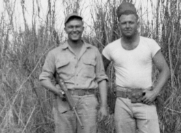 Men of 330th Troop Carrier, 9th CC, stand in a field with a carbine in the CBI during WWII.  On the left appears to be the person labeled “POP” in the bottom left of the Engine Change Crew photo, standing on the right of Arnold. POP appears in a few other photos too—he may have been an important member of the team.  From the collection of Arnold Wall. (Much appreciation to son D. W.)
