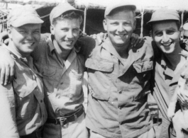 Men of 330th Troop Carrier, 9th CC.   Arnold Wall with three other buddies. No names on the back of the original picture, however, from left to right, the men are likely Arnold Wall, Dave Sobel, R. C. Werner, and Milt Sobel.  From the collection of Arnold Wall. (Much appreciation to son D. W.)
