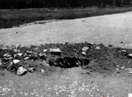 Remains of a blast in a runway, probably Liuzhou after retreat from the Japanese in 1944.