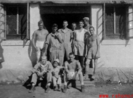 "The Adopted One--This Is A Group Of The 396th Guys Having Their Picture Taken With A Small Chinese Boy That We Adopted As A Mascot. " Caption courtesy of Elmer Bukey.