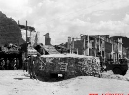 A GI inspects a bunker near Liuzhou in WWII, in 1945.