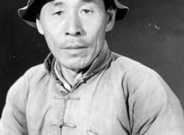 Chinese man in China poses for the photographer. During WWII.