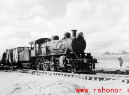 Allied gas train at the edge of the field, Liuzhou (Luichow), China Sept 1944, after a Japanese bombing raid, during WWII.