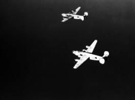 B-24 bombers in flight over water in the CBI. 