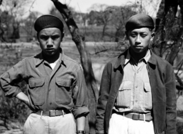 Two young Chinese men in China, most likely on an American base where they work as staff. During WWII.