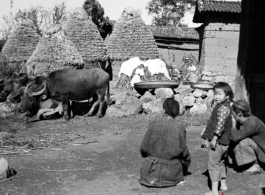 People in a small village in China, probably in Yunnan province.