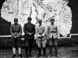 Chinese soldiers in the CBI standing before mural. During WWII.