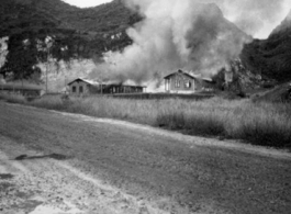 Al's notation is "Burning everything before evacuation." American hostels at the base burn during the American and Chinese retreat before the Japanese arrive in the fall of 1944.  Guangxi province, Liuzhou air base.