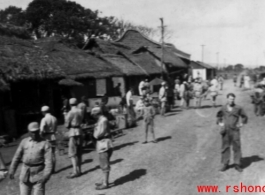 GI Joe and Chinese soldiers on a village street, probably outside of Yangkai base, Yunnan.