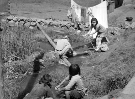 Local people in washing clothes in Yunnan province, China.