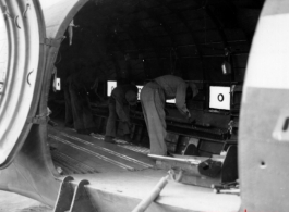 10AF 10Dec44 Preparing to load mules on [C-47] cargo plane, Burma, during WWII.