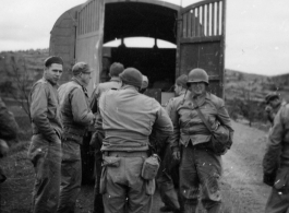 American GIs stop along the Burma Road on a cool day during WWII.