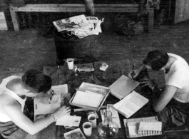 Barracks life at an American base in southwest China during WWII GIs take care of correspondence.  