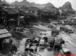 Houses, boats, and products along the riverside on the southside, at Liuzhou city, Guangxi province, China, near the US Airbase during the Second World War.  Photo from Selig Seidler.