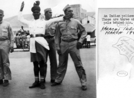 GIs pose with traffic policeman in Karachi, India, March 1942.