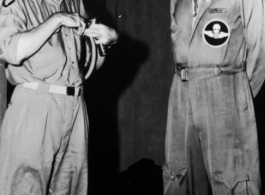 Two American US Army Air Force flyers chat in the CBI during WWII.