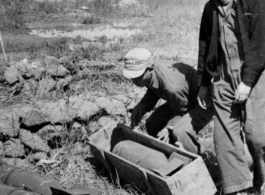 Workers in China unbox aerial bombs in the CBI during WWII. 