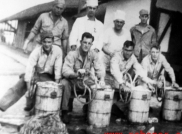 GIs hand-crank barrels of ice cream in the CBI during WWII.