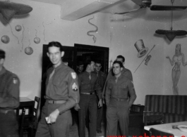 GIs walk into a hall in the CBI.