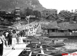 Floating boat-bridge, Floating "boat-bridge, looking towards our side of Luichow, China Sept 1944."  Horse-Saddle mountain (马鞍山) in the background. towards our side of Luichow, China Sept 1944.  From the collection of Frank Bates.