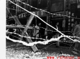 Newly installed barbed wire and barricades in Liuzhou before the Japanese Ichigo advance in the fall of 1944  From the collection of Hal Geer.