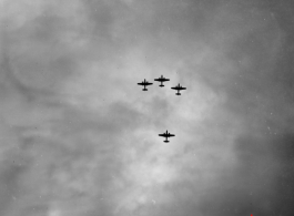 B-25 Mitchell bombers in flight in the CBI near an American air base, in the area of southern China, Indochina, or Burma. During WWII.
