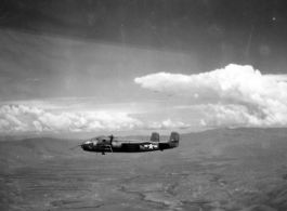 B-25 Mitchell bombers in flight in the CBI, in the area of southern China, Indochina, or Burma. During WWII.