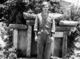 GI Poses with Chinese grave marker in Yunnan, China, during WWII.