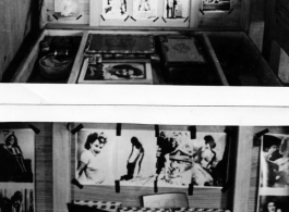 A travel box with letters and pin-up girl pictures in the barracks on an American base in Yunnan, China, during WWII.