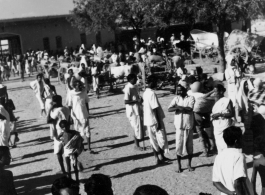 Busy market area.  Scenes in India witnessed by American GIs during WWII. For many Americans of that era, with their limited experience traveling, the everyday sights and sounds overseas were new, intriguing, and photo worthy.