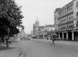 Street in large Indian city.  Scenes in India witnessed by American GIs during WWII. For many Americans of that era, with their limited experience traveling, the everyday sights and sounds overseas were new, intriguing, and photo worthy.