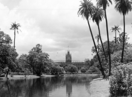 Ornate building on manicured grounds.  Scenes in India witnessed by American GIs during WWII. For many Americans of that era, with their limited experience traveling, the everyday sights and sounds overseas were new, intriguing, and photo worthy.