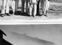 GIs pose with people in India.  Scenes in India witnessed by American GIs during WWII. For many Americans of that era, with their limited experience traveling, the everyday sights and sounds overseas were new, intriguing, and photo worthy.