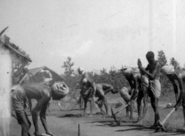 Workers dig up a well-driven surface.  Scenes in India witnessed by American GIs during WWII. For many Americans of that era, with their limited experience traveling, the everyday sights and sounds overseas were new, intriguing, and photo worthy.