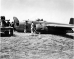 An MP hovers around a crashed B-25 Bomber in the CBI during WWII.