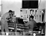 Cpl. Provondo and Sgt. Williamson work at the receiver repair bench at Chanyi, China, during the Second World War.   AACS Sta. No. 251, 128th Squadron, Chanyi, China.