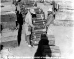 Chinese soldiers arrange equipment and munitions into 5000 lbs loads for air drop to Allied forces in Burma. 1944.