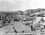 Chinese troops in Burma await transport on C-47 to China. Note the row of C-47 transport planes waiting. December 10, 1944.